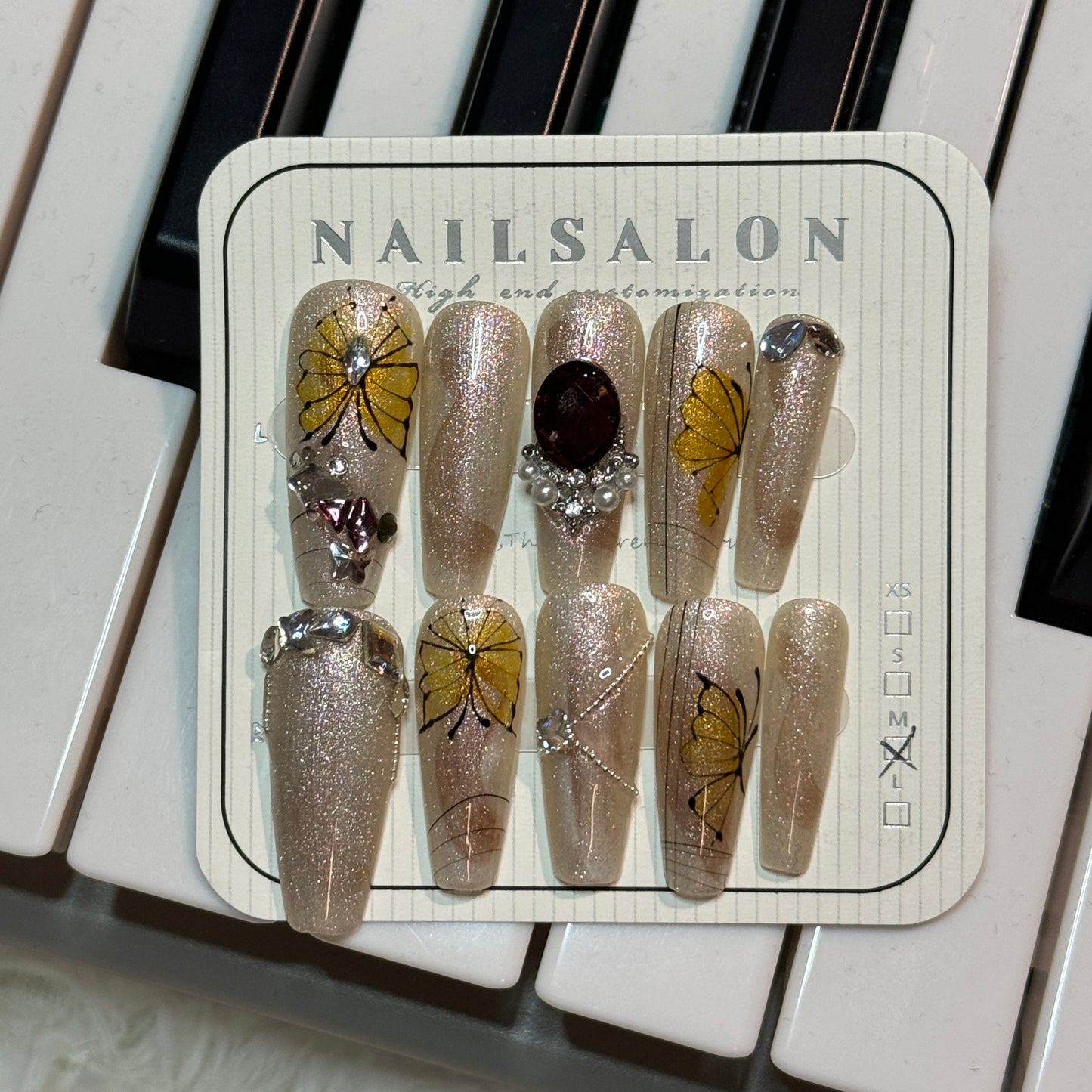 press-on nails / golden butterfly champagne