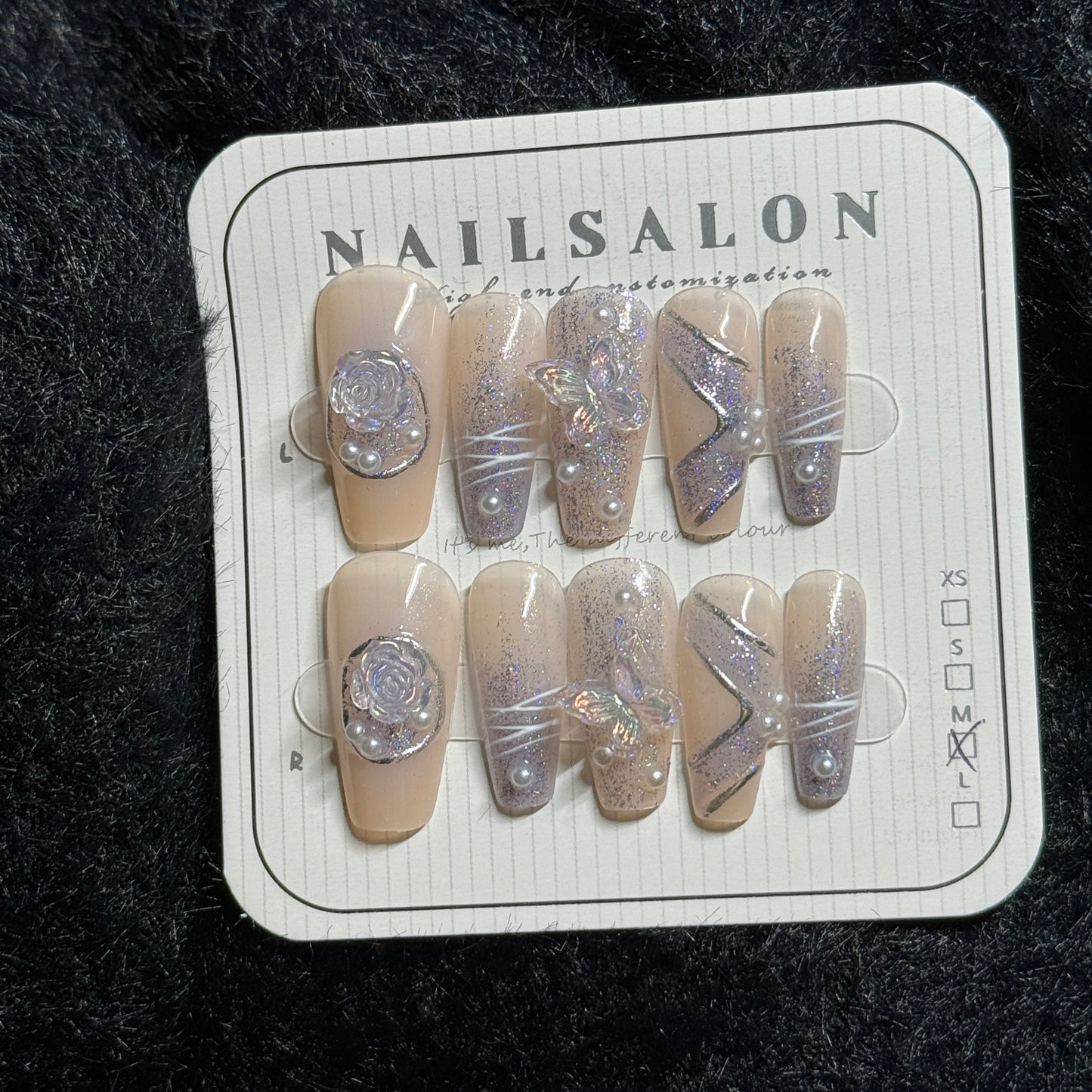 press-on nails / nude color w purple pattern and pearls