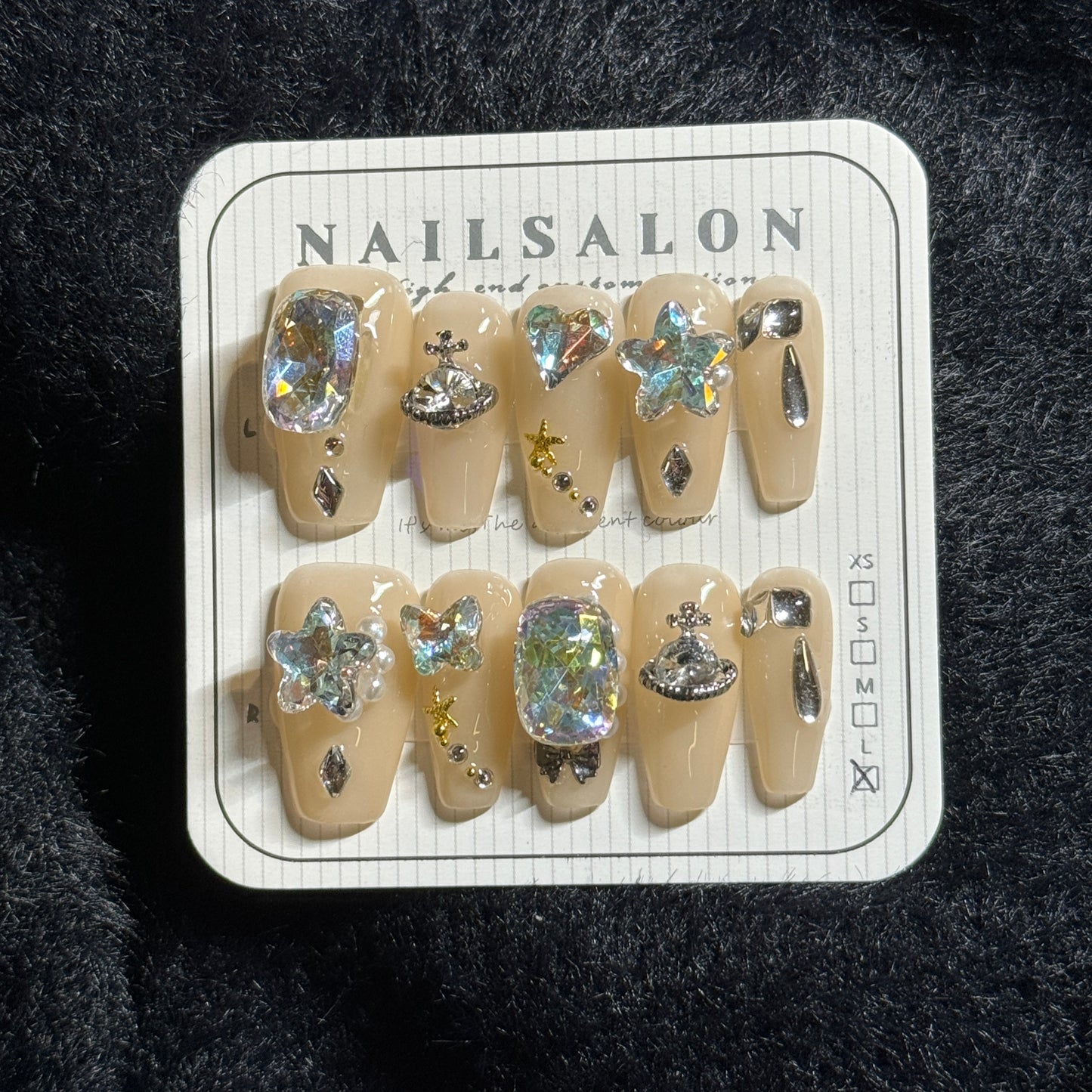 press-on nails / light neutral with Vivienne Westwood stones and stars