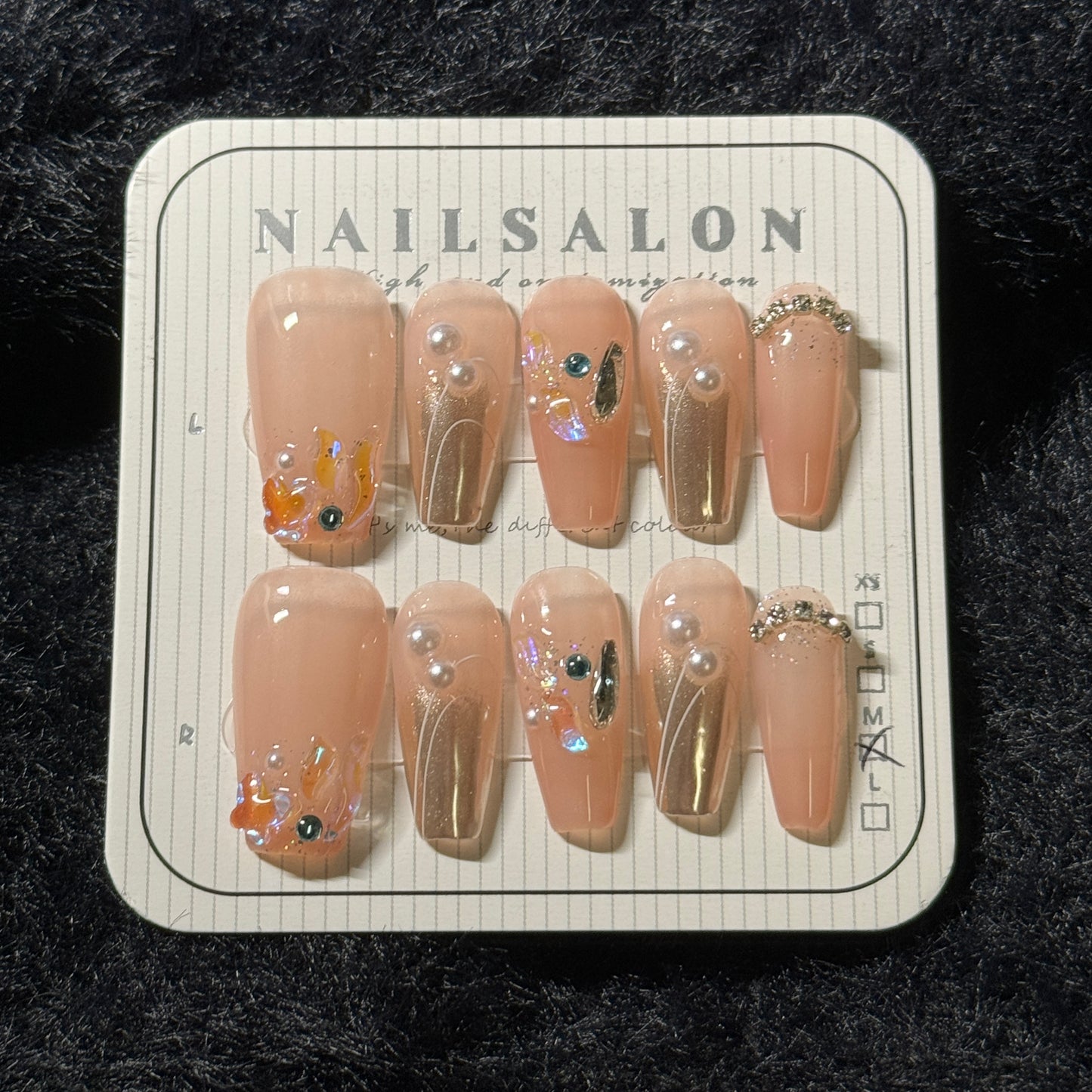 press-on nails / orange-pink golden with colorful stones and pearls