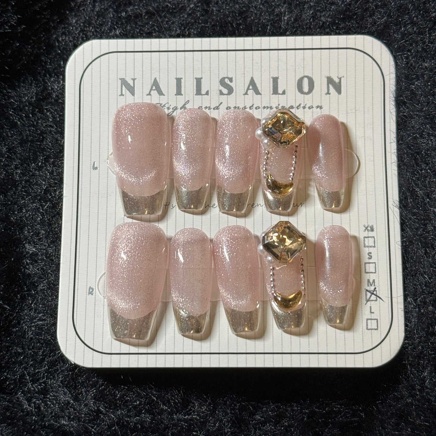 press-on nails / pink cat-eye with French golden tip and stones