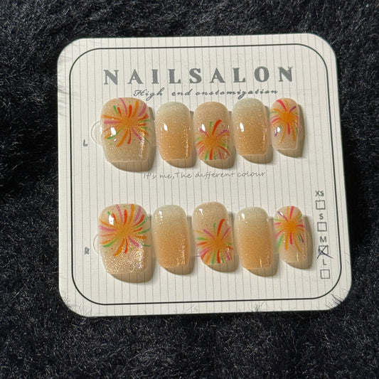 press-on nails / orange cat-eye fireworks