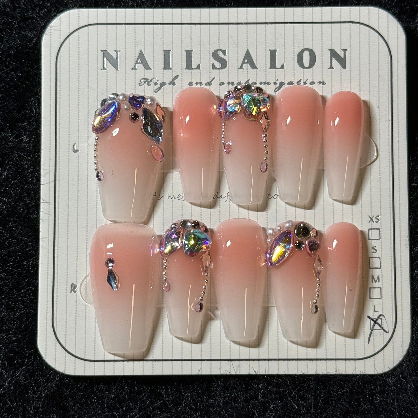 press-on nails / orange-pink gradient white with colorful stones