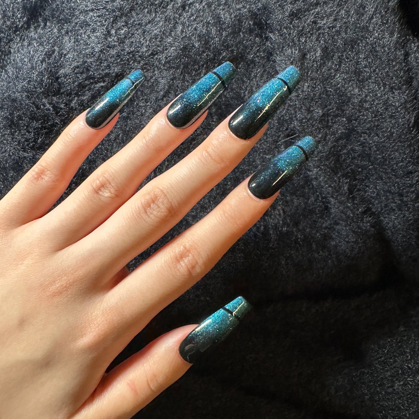 press-on nails / black and blue-green sparkles