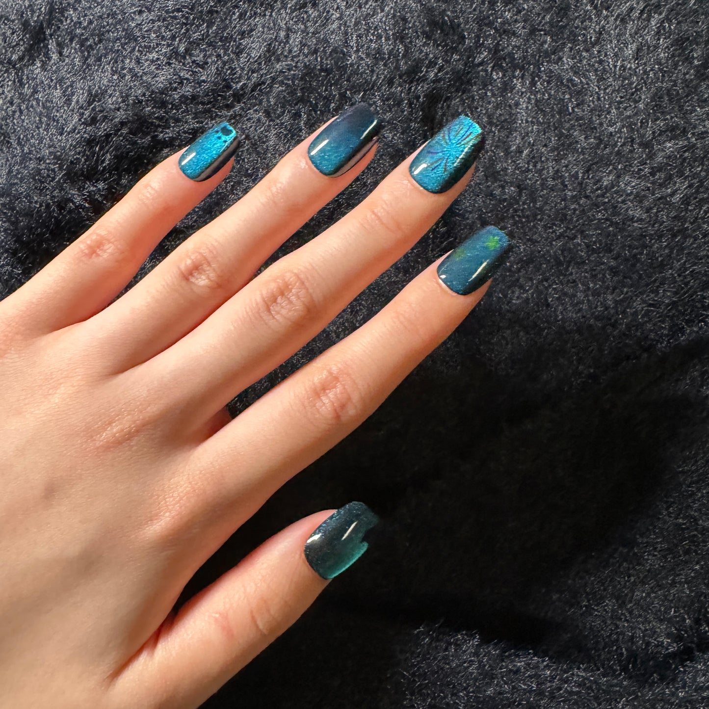 press-on nails / blue-green cat-eye with cat and fireworks