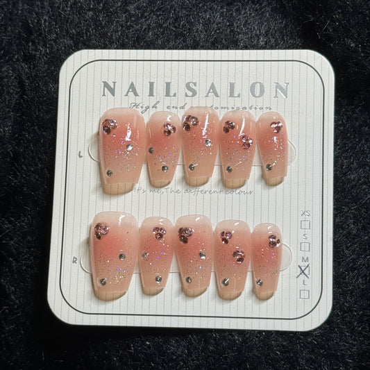 press-on nails / orange-pink blush with stones